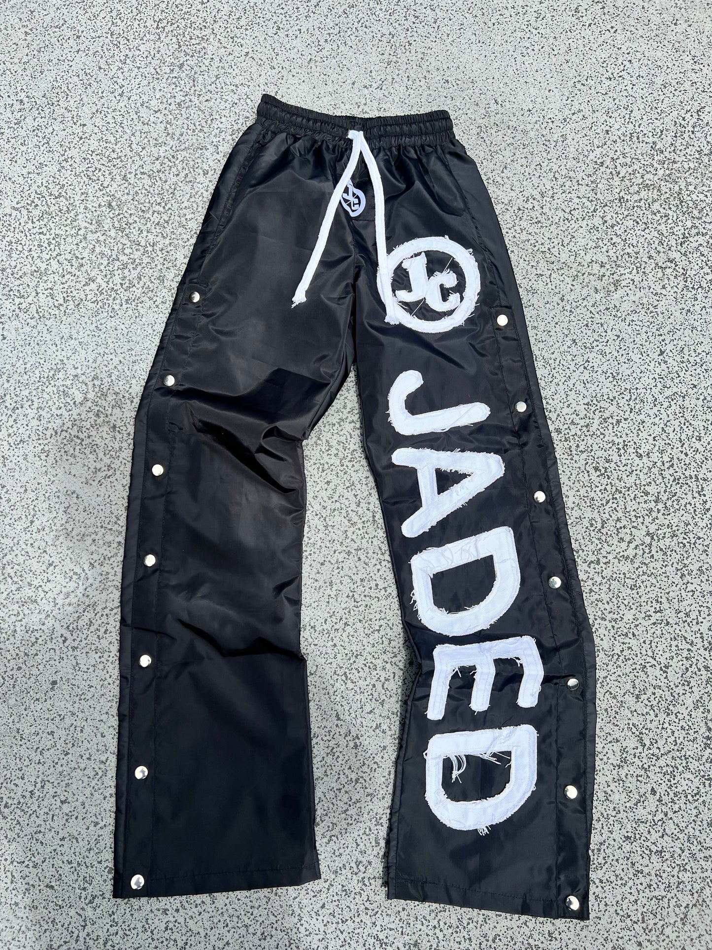 BLACK WINDBREAKER PANTS
